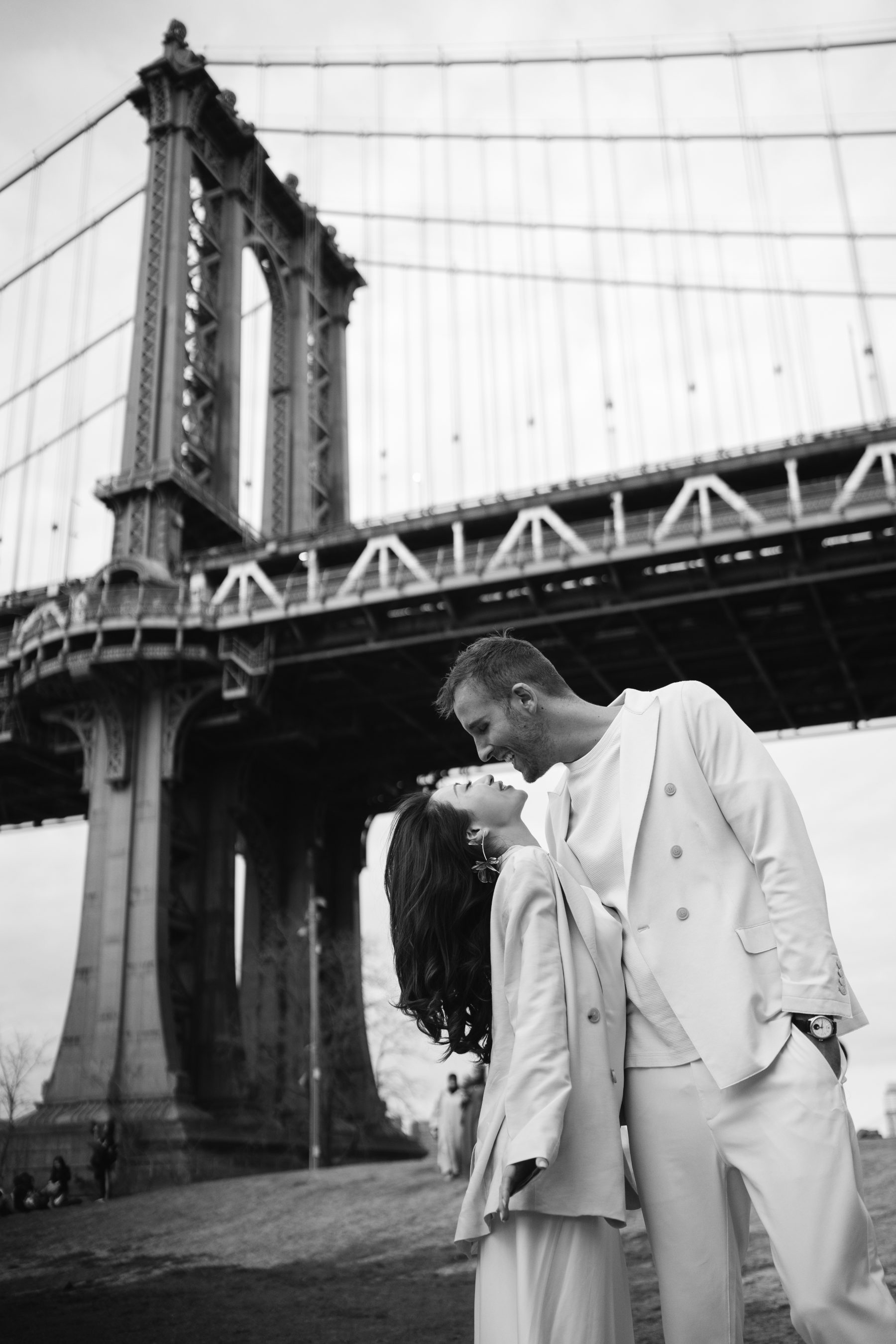 Black and white portrait under the Manhattan Bridge